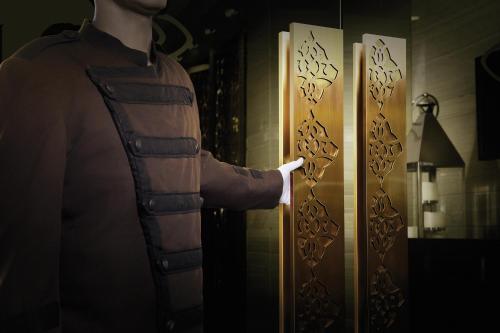 a man is standing in front of a refrigerator at Sofitel Wellington in Wellington