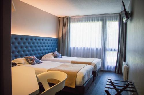 The Originals City, Hôtel Les Caps, Saint-Brieuc Estにあるベッド