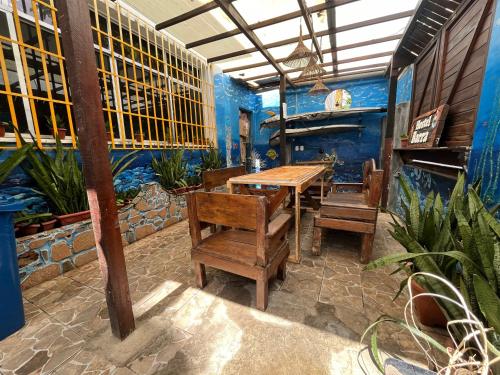 a dining room with a table and chairs in a restaurant at Hostel Barra in Salvador