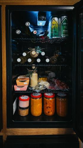 a refrigerator filled with lots of food and drinks at Živili in Smilkov