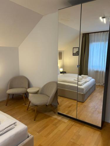 a bedroom with a bed and a mirror at Near airport Zagreb 3, WiFi, Netflix, Self check in in Velika Gorica