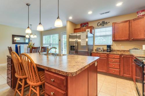 a kitchen with a large island in the middle at Home 2 Mi to Island in Pigeon Forge! in Pigeon Forge