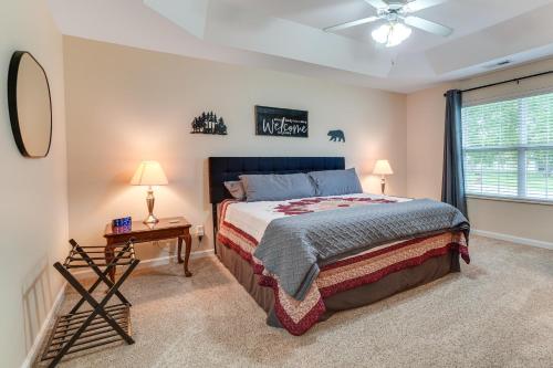 a bedroom with a bed and a window at Home 2 Mi to Island in Pigeon Forge! in Pigeon Forge