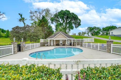 a swimming pool in a yard with a house at Home 2 Mi to Island in Pigeon Forge! in Pigeon Forge
