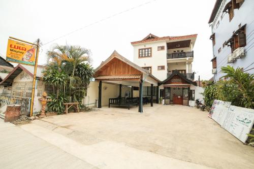 an empty street in a city with buildings at Maylay Guesthouse in Vang Vieng