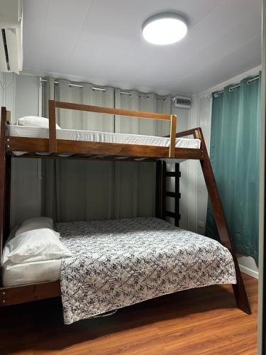 a couple of bunk beds in a room at Villa Conejo in Santa Cruz