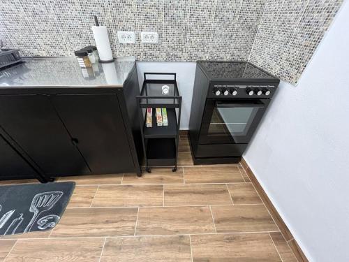 a kitchen with a stove and a counter top at Los Abuelos Vivienda Vacacional in Valverde