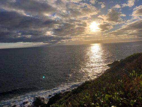 a sunset over the ocean with the sun in the sky at Los Abuelos Vivienda Vacacional in Valverde