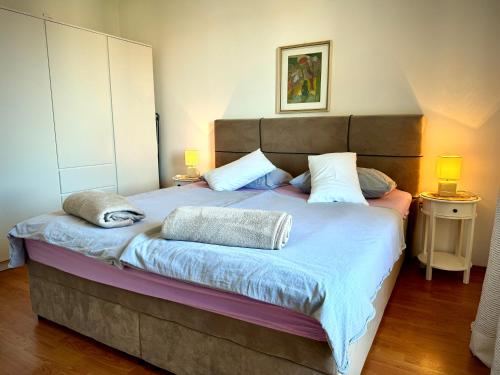 Postel nebo postele na pokoji v ubytování Apartments Maričić Banjol