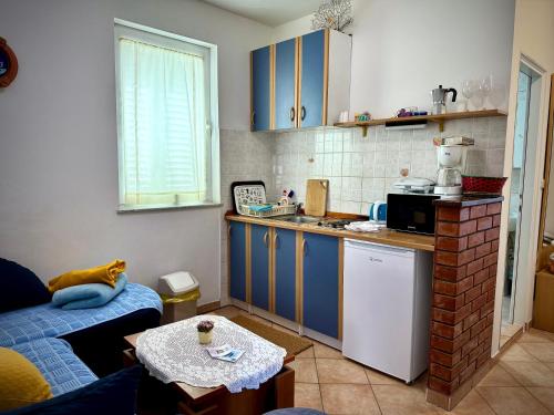 Kuchyň nebo kuchyňský kout v ubytování Apartments Maričić Banjol