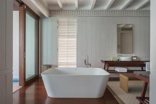 a large white bath tub in a bathroom at Park Hyatt St. Kitts in Christophe Harbour