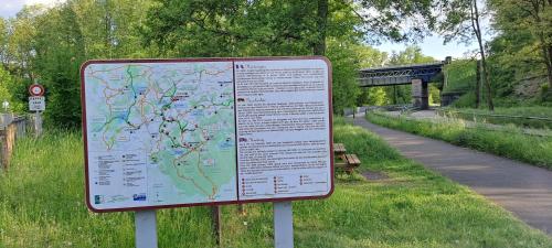 a sign with a map on the side of a road at Gîte de La Forge in Hesse