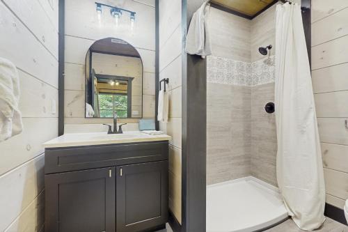 a bathroom with a sink and a shower at Getaway Pointe in Sevierville
