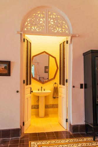 a bathroom with a sink and a mirror at Casa Niza - Colonial house in Cartagena de Indias