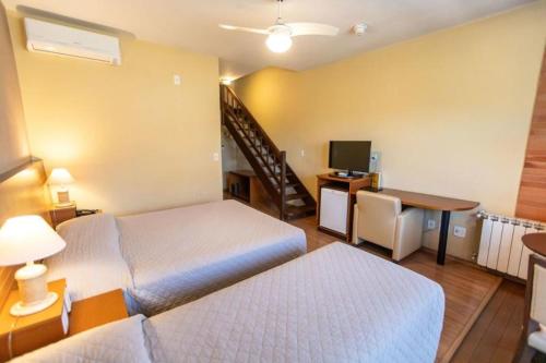 Ένα ή περισσότερα κρεβάτια σε δωμάτιο στο Hotel Serra Nevada