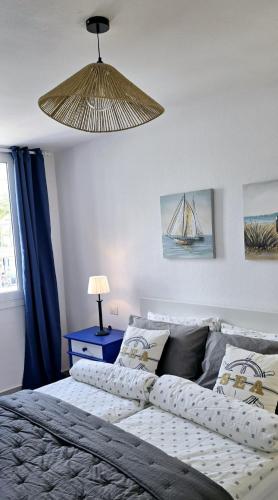 a bedroom with a large bed and a lamp at Las Americas Blue Ocean Apartment in Costa de Adeje