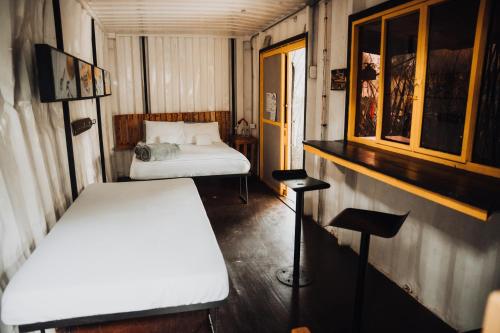 Una cama o camas en una habitación de Redwood Salento