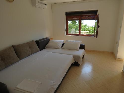 Posteľ alebo postele v izbe v ubytovaní Holiday Home Milovci