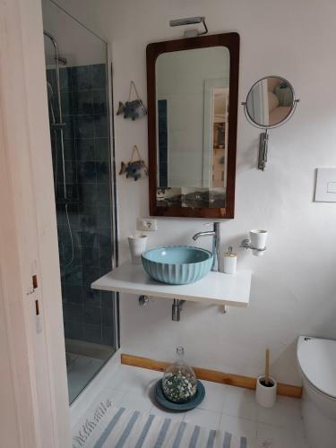 a bathroom with a sink and a mirror at CASA CELESTE in San Nicola Arcella