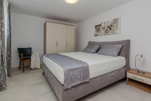Posteľ alebo postele v izbe v ubytovaní Apartments Tukara