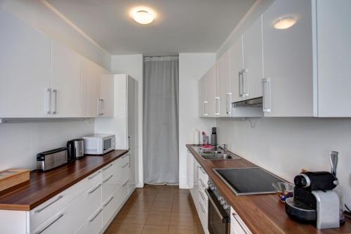 Η κουζίνα ή μικρή κουζίνα στο Gasser Apartments - Apartments Karlskirche