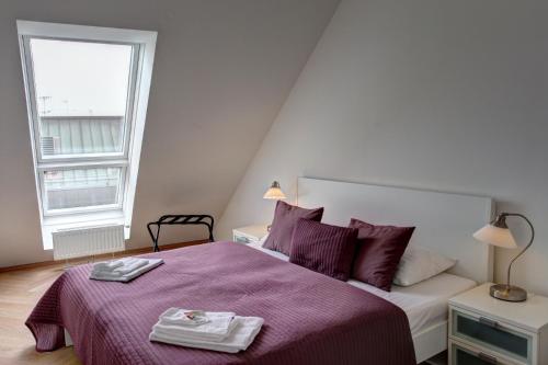 Ένα ή περισσότερα κρεβάτια σε δωμάτιο στο Gasser Apartments - Apartments Karlskirche