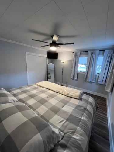 a bedroom with a bed and a ceiling fan at The Moravian in Allentown