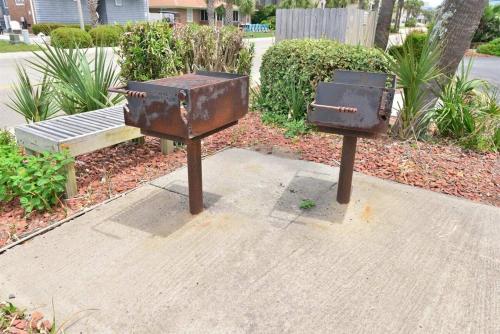 two rusted out chests sitting next to a bench at Ocean View Windy Village Unit 2B 2 bedroom 2 bath Sleep 6 Pool in North Myrtle Beach
