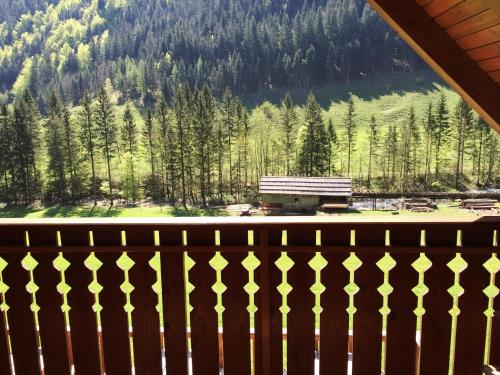 a view from the balcony of a cabin with a mountain at Govc-Vršnik in Solčava