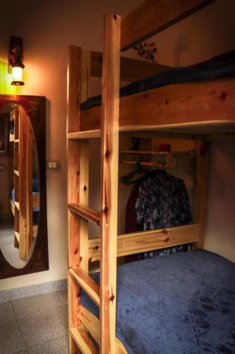 Una cama o camas en una habitación de Tecoma Hostel