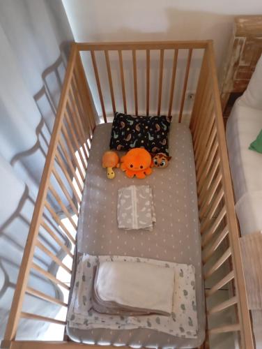 a crib with stuffed animals sitting on it at Gili Matiki in Gili Air