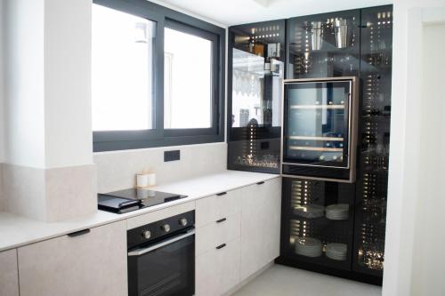 Kuchyň nebo kuchyňský kout v ubytování Kalinifta Rooms Luxury Style