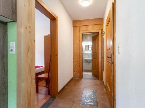a hallway of a room with a bathroom at Schweizerhof Enzian in Huben