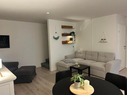 a living room with a couch and a table at Home in Selfoss in Selfoss