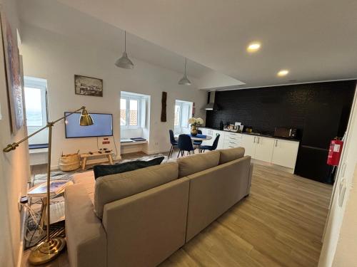 a living room with a couch and a table at Casa do Aviador in Relva
