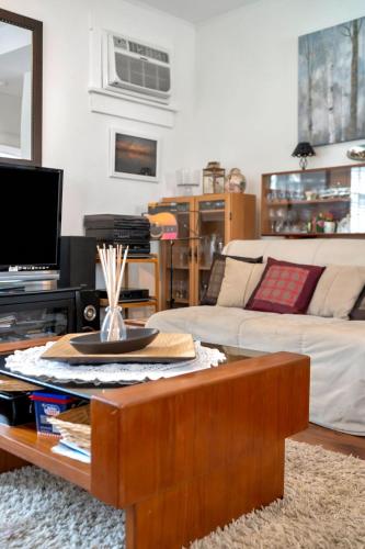 a living room with a couch and a coffee table at The Cardinal - 7 Hollow in Cherry Valley