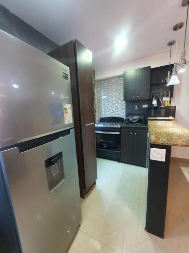 Η κουζίνα ή μικρή κουζίνα στο 55-1 Lindo apartamento ejecutivo