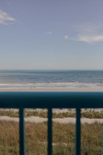 a view of the ocean from a balcony at Southern Breeze Ocean Front Hotel in Myrtle Beach