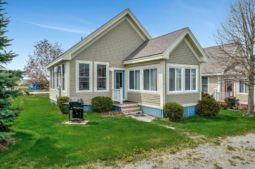 a house with a lawn in front of it at The Cottontail - 6 Meadowview Lane in Cherry Valley