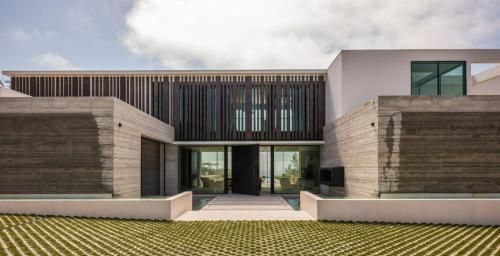 a rendering of a house with a building at The Dume Legacy in Malibu