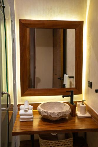 a bathroom sink with a large mirror above it at Bali 4BR Villa w Pool, Rooftop Jacuzzi and BBQ in Tulum