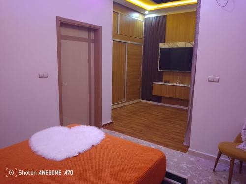 Кровать или кровати в номере Appartement Duplex Sidi Bouzid Luxury