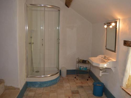 a bathroom with a shower and a sink at Moulin atypique du XVème siècle avec jardin clos - FR-1-381-483 in Arpheuilles