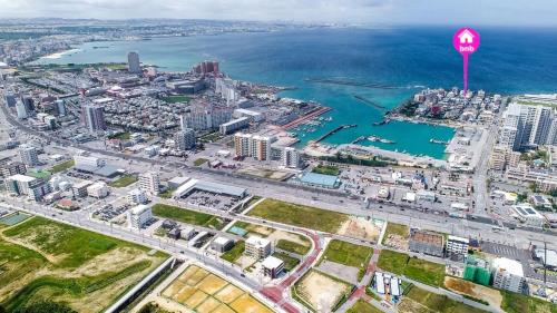 an aerial view of a city with a stop sign at 北谷町港2 in Chatan