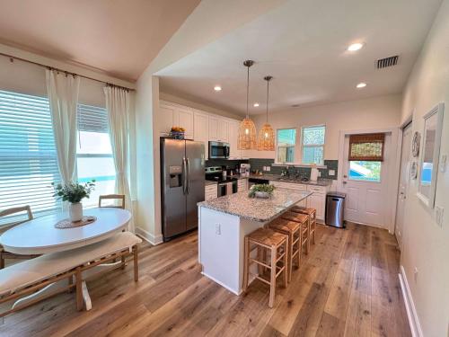 a kitchen with a table and a counter top at The Orange Blossom Suite Near UF Shands D-town in Gainesville