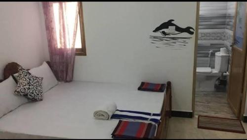 Ένα ή περισσότερα κρεβάτια σε δωμάτιο στο Ashok Guest house