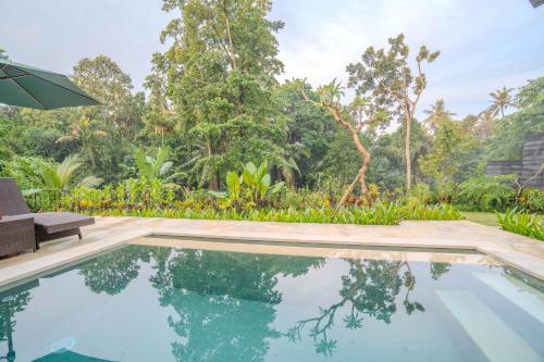 an image of a swimming pool in a villa at Arca Jungle View Luxury Villa Ubud in Ubud