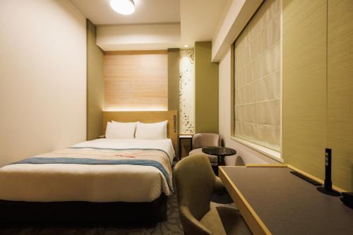 Ένα ή περισσότερα κρεβάτια σε δωμάτιο στο Hotel Metropolitan Tokyo Marunouchi