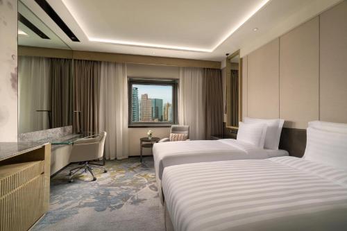 Ένα ή περισσότερα κρεβάτια σε δωμάτιο στο Kempinski Hotel Beijing Yansha Center