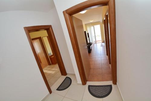 a hallway with two doors and a tile floor at Apartments Soso in Kotor